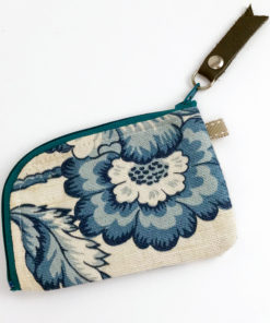 image of a small woman's floral blue toile linen zipper card wallet on its one side