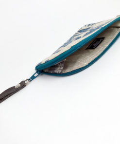 Wallet open on its side showing the inside and the zipper gusset