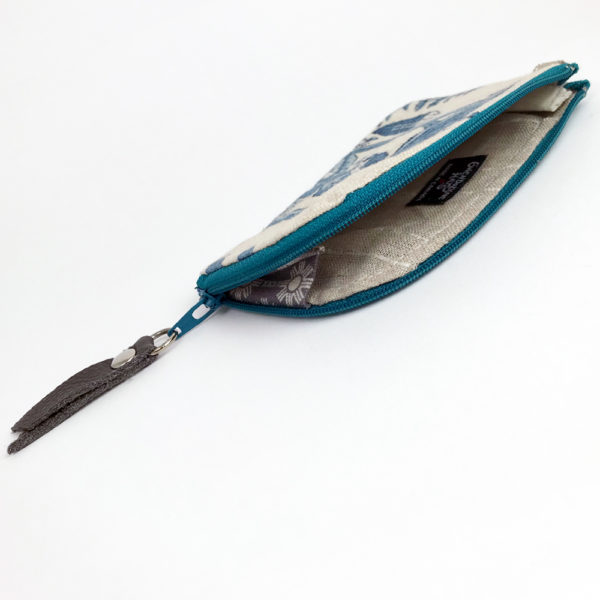 Wallet open on its side showing the inside and the zipper gusset