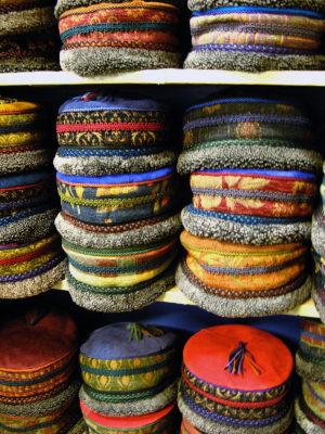 A shelf full of Tibetan Hats