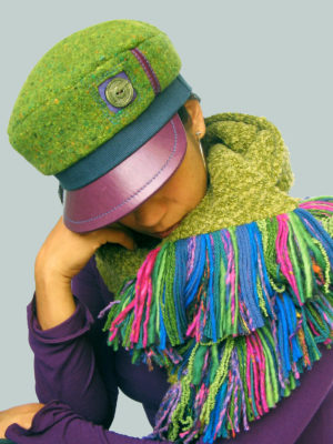 A close up of woman wearing a Abbey Road Cap in colors lime green and purple