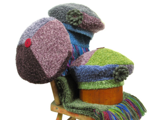A group of 3 The Ashely Beret Designs on a boucle knit scarf