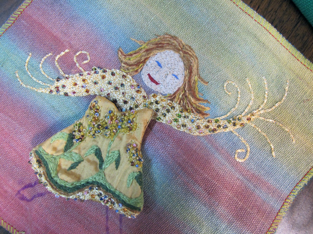 Close up of embroidery artwork of Air Goddess