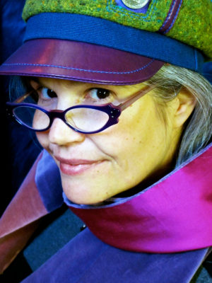 Gwendolyne wearing a Abbey Road wool cap and velvet silk scarf