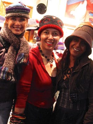 3 women standing wearing Gwendolyne Hats at the one of a kind show in Toronto
