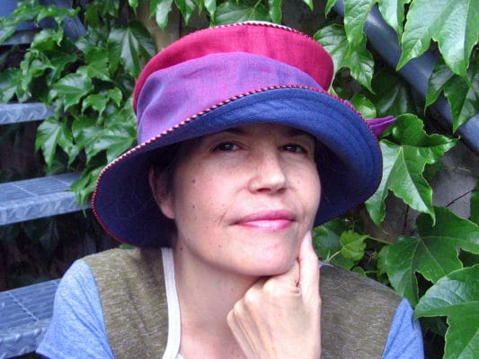 Gwendolyne wearing one of her Zinnia Linen Summer Brim hats