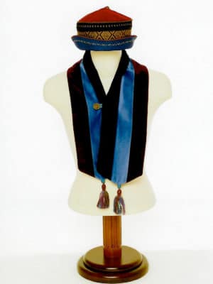 The Baatar cap and velvet tassel scarf is on a display mannequin