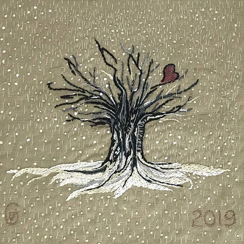 Hand embroidered winter tree with snow falling