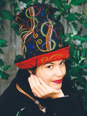 Close up of Gwendolyne Preboy modelling the embroidered Sugar Sack Hat made for the Museum of Textiles Show