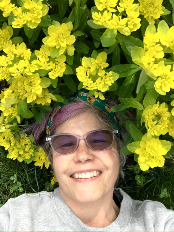 Gwendolyne smiling under a euphoria bloom