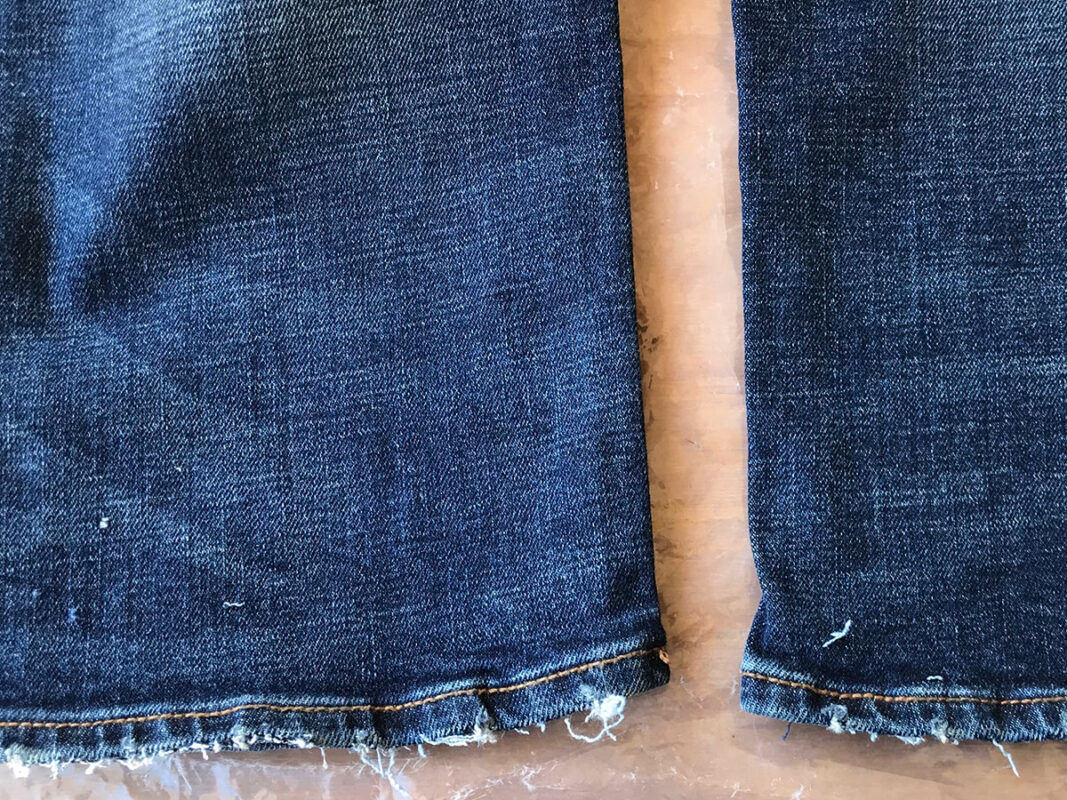 Aged detail of the jean leg bottom hems